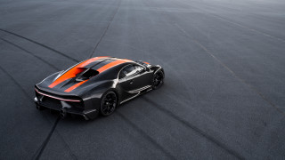 Black orange sportscar racetrack tiltshift - a race track free wallpaper