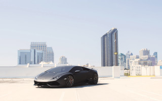 Black sports car city skyline - skyscraper free wallpaper
