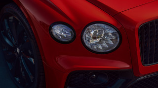 Red sports car headlights grills - a dark street free wallpaper