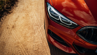 Red car dirt road forest - detailed face free wallpaper