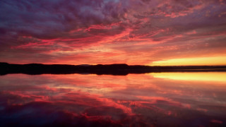 Sunset water reflection clouds cityscape - widescreen free wallpaper