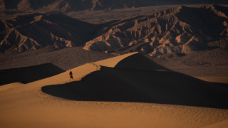 Desert dune person mountains sunset - sunset free wallpaper