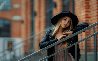 Woman blackhat jacket brickwall portrait - outside free wallpaper