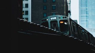 Train city tallbuildings bridge trafficlights - depth of field free wallpaper