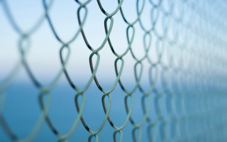 Chain link fence ocean blurry - anni alber free wallpaper