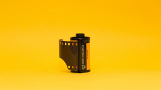 Camera battery yellow background black - format print free wallpaper