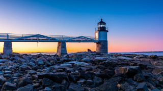 Lighthouse rocky shore bridge sunset 2 - a rocky shore free wallpaper