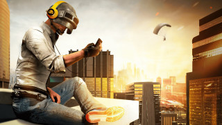 Man helmet sitting cityscape skyscraper - a ledge free wallpaper