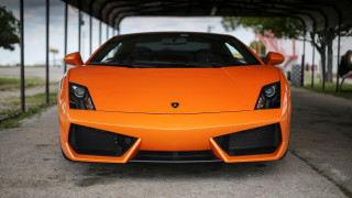 Bright orange sports car parking 4 - a parking lot next free wallpaper