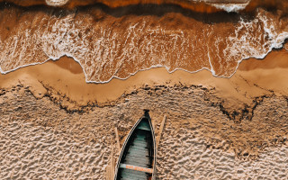 Boat beach waves sand cityscape - near free wallpaper for desktop