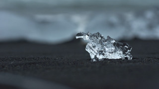 Ice black sand beach ocean - wave free wallpaper