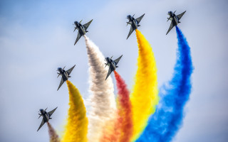 Jets colored smoke flying formation - a blue sky background free wallpaper