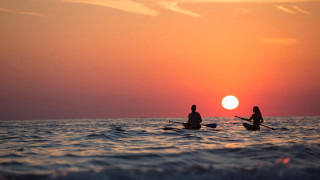 Sunset boat paddle ocean horizon - two person free wallpaper