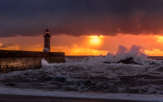 Lighthouse wave sunset stormy beach - almada negreiro free wallpaper