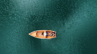 Small boat lake people blonde - a large body of water free wallpaper