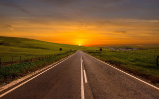 Sunset road fence grass cityscape - a long road free wallpaper