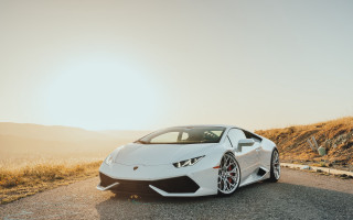 White sports car mountain road - a mountain in the background free wallpaper