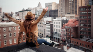 Woman rooftop cityscape blurry architecture - her arm free wallpaper