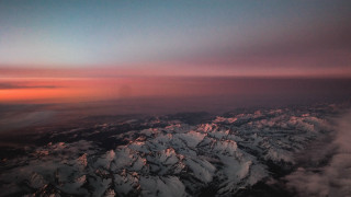 Mountain range sunset pink sky 5 - a view of a mountain range free wallpaper