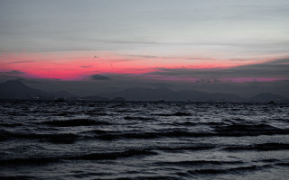 Sunset ocean mountains boat saturated - a sunset over the ocean free wallpaper