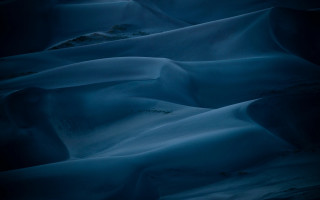 Dark blue snowy cave mountain - blue background free wallpaper