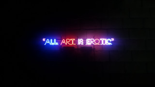 Neon sign art erotic dark - a brick wall free wallpaper