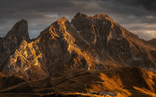 Mountain range house clouds dusk - dramatic free wallpaper