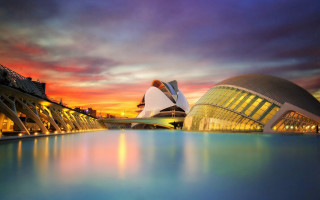 Large building water sunset cityscape - a colorful sky free wallpaper