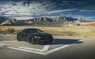 Black sports car mountains clouds - sinister free wallpaper