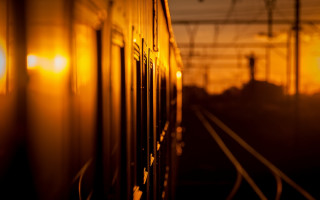 Train sunset backlighting blurry orange - a train free wallpaper