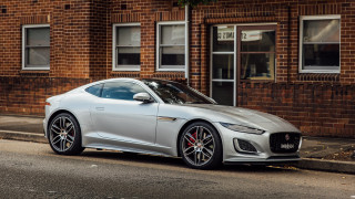 Silver sports car brick building 2 - the side of the road in front free wallpaper