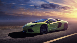Green sports car sunset cloudy 2 - the background and a sun setting free wallpaper