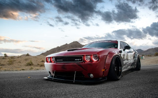 Red sports car cloudy mountains - the side of the road free wallpaper