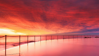 Sunset beach fence water red - a sunset view of a beach free wallpaper
