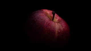 Red apple water droplets dark 3 - a red apple free wallpaper