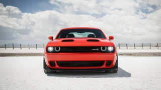 Red car beach cloudy sky - a sandy beach under a cloudy sky free wallpaper