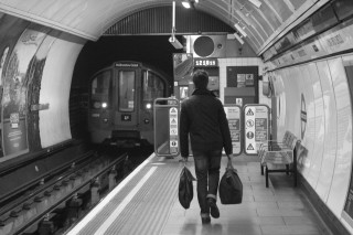 Man train station luggage black - underground free wallpaper