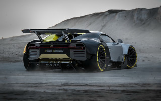 Black yellow sports car mountain - a sky background and a mountain range in the background free wallpaper