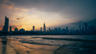 City skyline water sunset clouds - a body of water in front free wallpaper