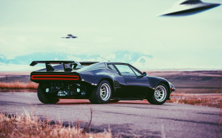Black car road field flying - retrofuturism free wallpaper
