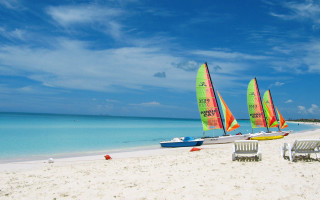Sailboats beach chairs cloudy sky - free bikini wallpaper
