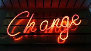 Neon change wall red background - a wall in a room free wallpaper