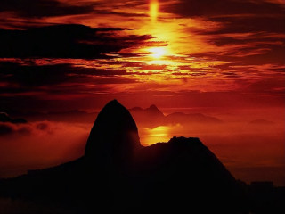 Sunset large rock orange sky - orange sun free wallpaper
