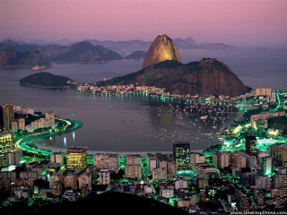 City mountain water night lit - a mountain in the background and a body of water free wallpaper