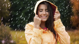 Woman smiling yellow raincoat rain - smiling free wallpaper