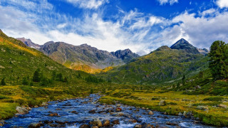 River valley mountains trees cloudy - a lush green valley free wallpaper