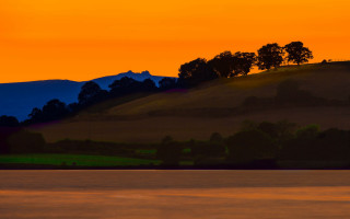 Lone boat sunset mountain yellow - landscape free wallpaper