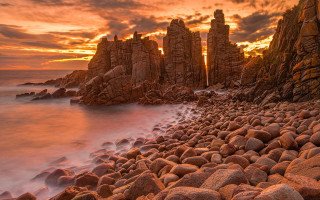 Rocky beach sunset water formation 2 - a rocky beach free wallpaper