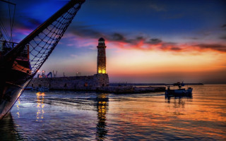 Lighthouse sunset mystical boat water - constantine andreou free wallpaper