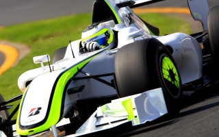 Man racecar track grass yellowline - a race car free wallpaper
